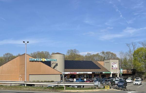 Street view of plaza, tanning and coffee is popular in Hamden