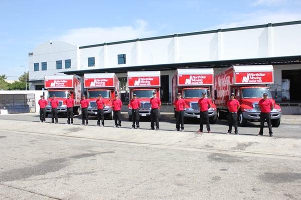 Our movers in front of some of our new trucks.