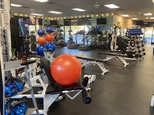 Cozy 24 hour fitness studio and gym. Members have key-card access, showers, towels, and can customize heat, light & music at will