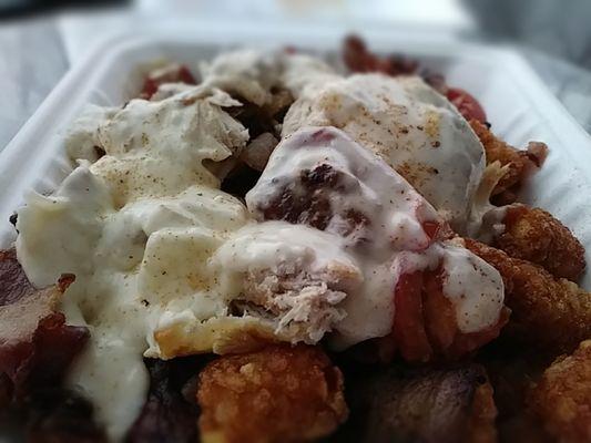 Hot Brown Tots: Turkey, tomatoes, bacon & mornay sauce. Get this!