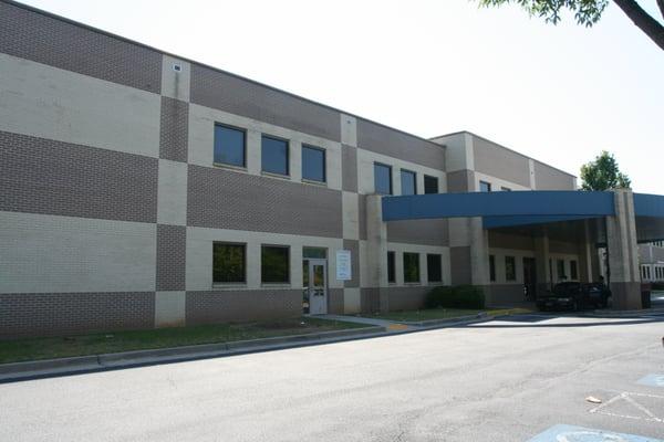 The tag office is on the left side of the building.