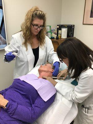 Dr. Norma performing injections of dilute Radiesse, a biostimulatory filler to reduce crepey skin of the neck at HK Dermatology