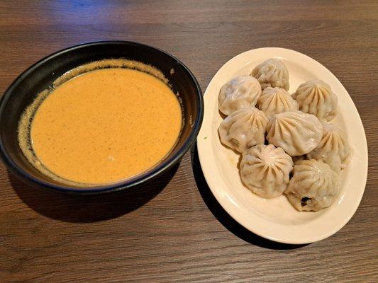 steamed lamb momos served with jhol