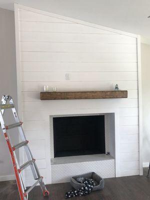 Project scope:
frame fireplace insert.
Shiplap and tile.
Paint.

Seattle, WA