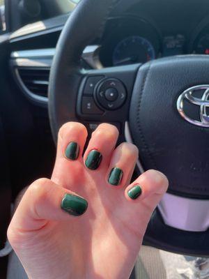 Dark green gel manicure