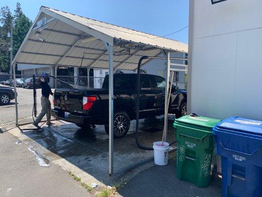 Pickup being washed before the pick up.