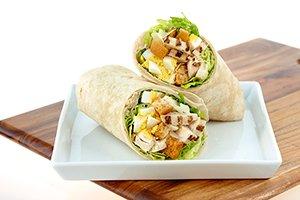 CHICKEN CAESAR WRAP: Chopped romaine & iceberg blend, all-natural chicken, chopped eggs, croutons, & parmesan cheese.