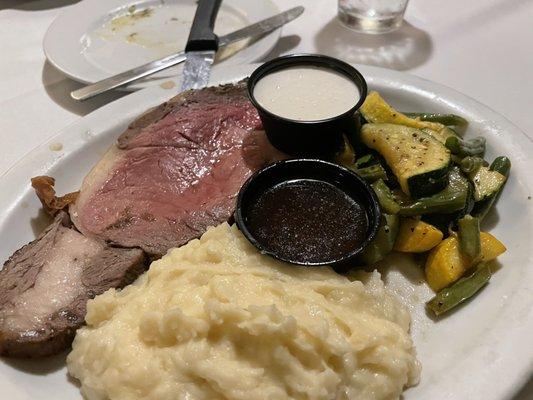 7 oz. Prime Rib cooked medium rare with mashed potatoes and veggies