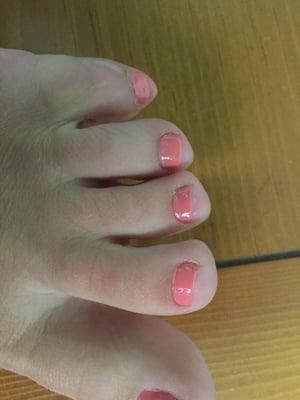 Uncut cuticles, poorly painted toes, crooked toe nails. This place is a disgrace. The owner is a greedy pig.