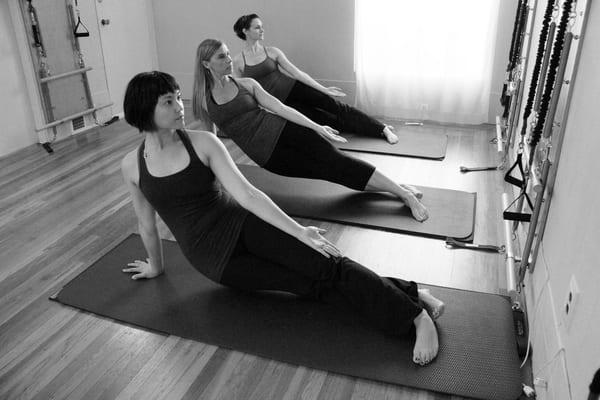 Bonnie, Heather and Amy practice Sidebend