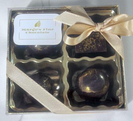 Decadent caramelized white chocolate ganache, enveloped in rich black chocolate, with a crunchy almond twist.