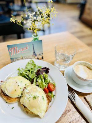 Egg, gruyère cheese, bacon, onion jam on croissant with greens, paired with a cappuccino.