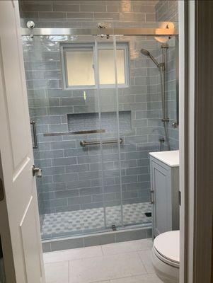 Small bathroom, but with the new shower tile and flooring, it helped brighten the small bathroom.