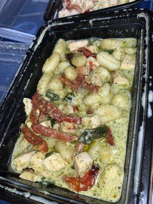 Gnocchi with pesto basil sauce, chicken, spinach, & sun dried tomatoes