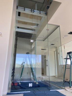 Custom 2 story wine room with glass floor