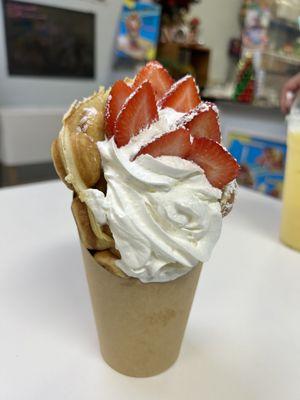 Bubble waffle with vanilla ice cream and strawberries