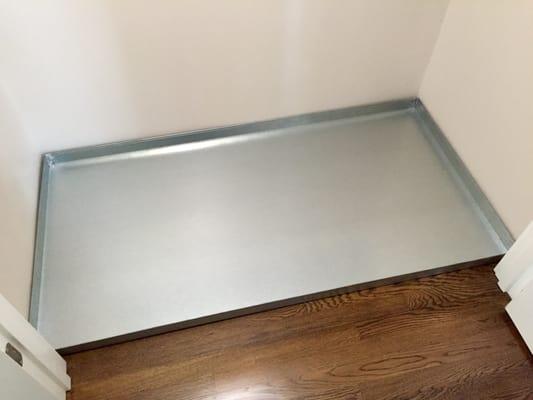 Custom washer/dryer pan for a tiny laundry closet