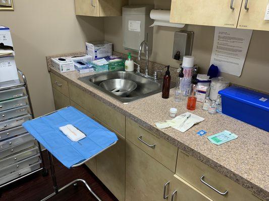 Sterile tray should be close to a sink and cleaning products