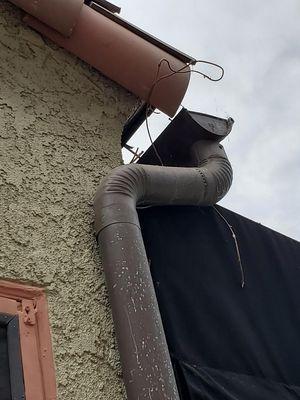 Original gutters left unattached to the roof.