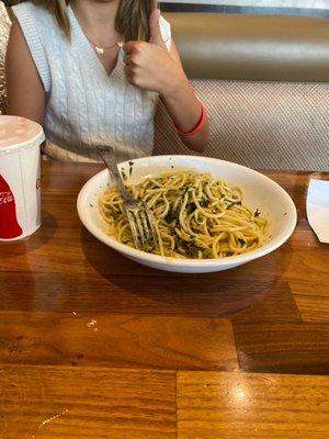 Kids meal pasta with pesto, cookie and drink. She loves it.