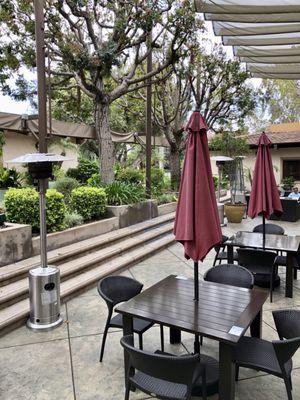 Nice comfortable courtyard with heat lamps and fountains.