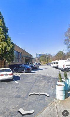 Long side of The Telephone Factory Lofts. Free parking anywhere in this lot. Only Saturday appointments need to register car for parking!