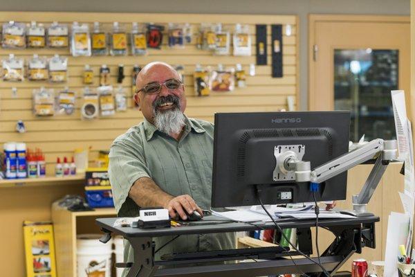 NBH hardware salesperson greeting a client.