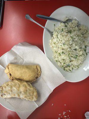 Cube Steak with rice and beans, empanadas with rice and beans.