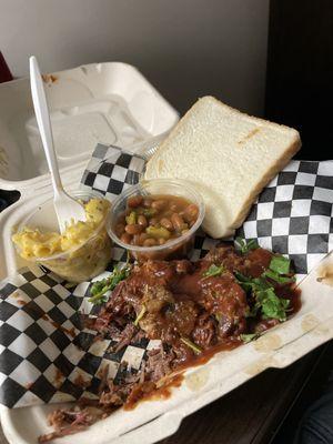 Brisket plate ! I ate half already but oh my goodness this is sooooo savory and sweet every thing hit the spot. Mac n cheese baked beans