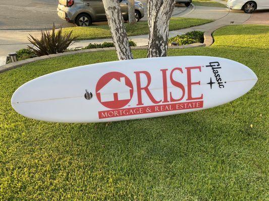 A custom made surfboard by Gene Levesque .