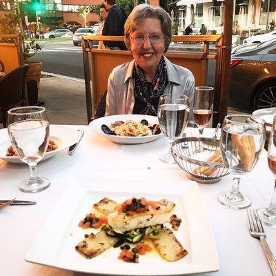 Mom with her seafood pasta made to her personal specs.