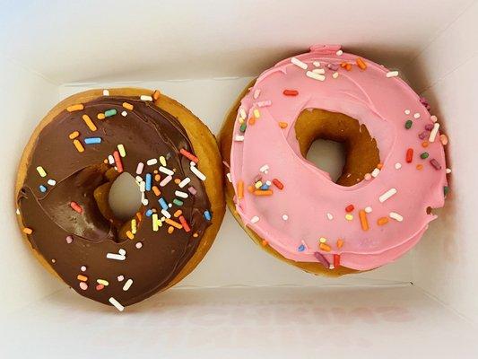 Chocolate frosted donut and strawberry frosted donut