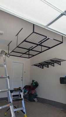 Installation of the storage system on the ceiling and on the wall in the garage