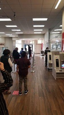 Line going out the door but only two tellers while the rest if the bank staff hiding in the breakroom.