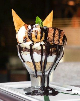 Signature Koi Sundae with profiterole and warm brownies drizzled in hot fudge.