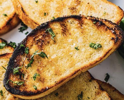 Fresh baked sourdough bread brought out upon request to sop up the grilled oyster liquor