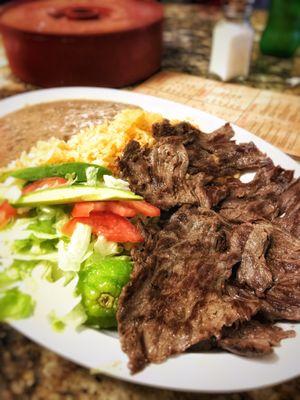 Carne Asada tacos plate, tons of homemade corn tortillas