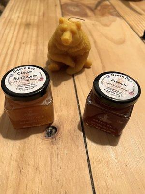 Honey wax candle and jars of honey