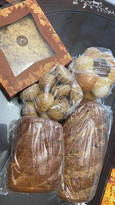 Clockwise: Crema apple crumble pie, sampler bread flower, cranberry walnut loaf, brioche loaf, black olive rolls