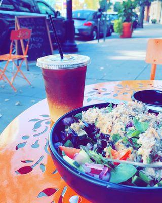 Garden salad with tuna and iced coffee with almond milk.