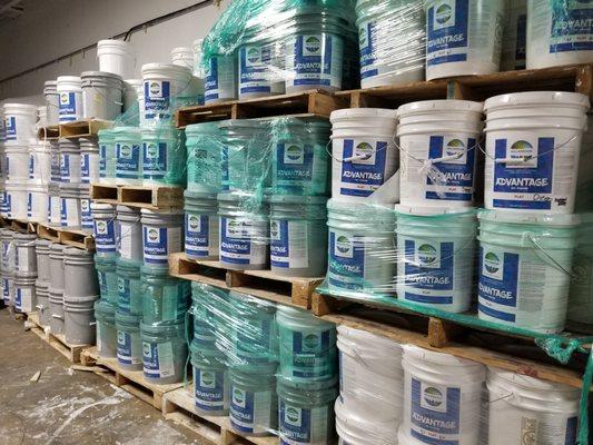 Pallets of Millennium paints advantage flat