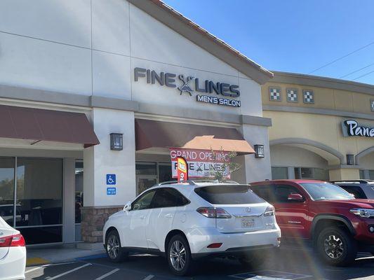 Front of Fine Lines, next to Panera Bread