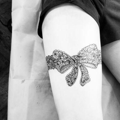 Lace bow tattoo