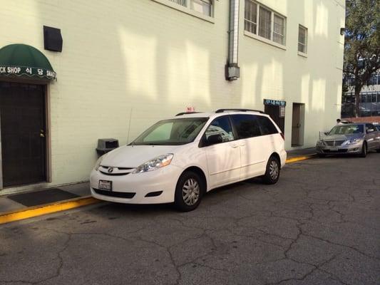 Snack shop entrance is on the side of the building in the parking lot. Has a small green canopy over the door.