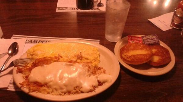 Cheese omelette with county gravy on the hash browns and an english muffin.