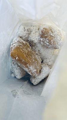 Beignets in a bag, coated with powdered sugar