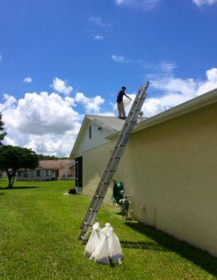 Giuseppe waterproofing the roof before the rain comes.  Thanks!!