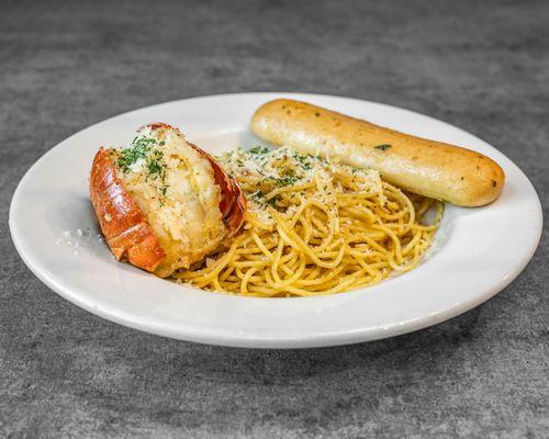 lobster tail serve with pasta and garlic bread