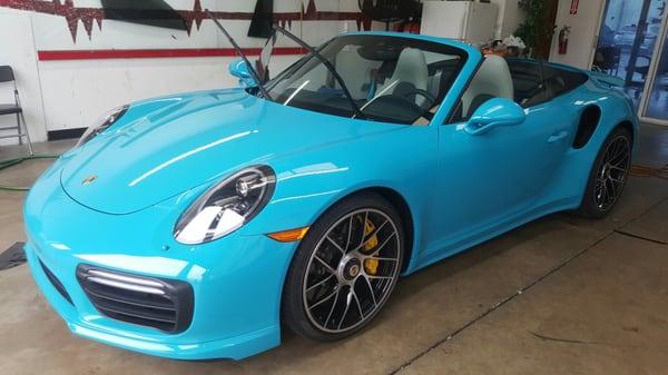 This is a very rare Miami Blue Porsche 911 Turbo we installed Llumar Ceramic Air Blue 80