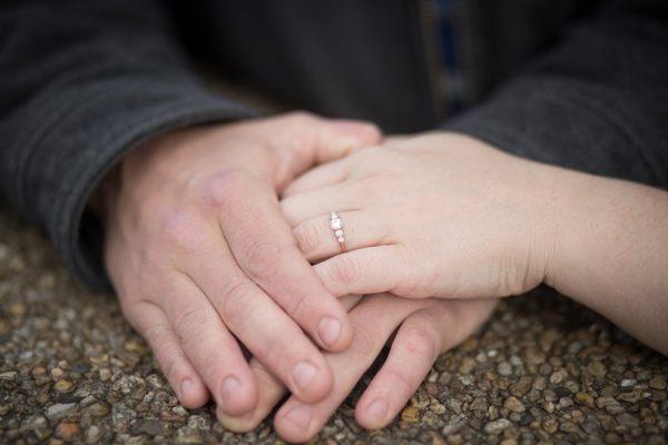 A photo of my hands and my fiancee's with the ring on it. A beautiful ring, gorgeous ethical diamonds, and wonderfully made to boot.